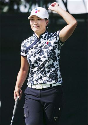 For the fifth time at Highland Meadows, Se Ri Pak celebrates on the 18th green. She had a two-shot lead going into yesterday's final round, fell behind by three shots, then rallied for a three-shot victory. 