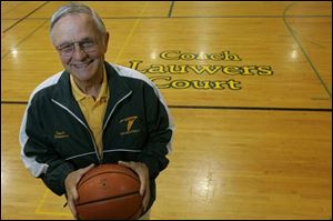 Ray Lauwers coaches on the court that bears his name. He has a record of 587-287 in 41 years at Monroe St. Mary.