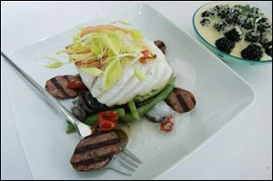 Chef Michael Bulkowski s halibut with green beans, cherry tomatoes, and smoked sausage.