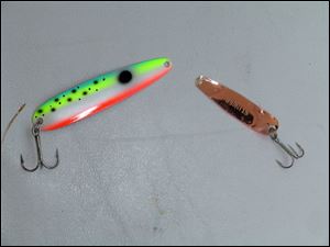 A pair of Michigan Stinger spoons, multicolor on one side and copper on the other, used for both steelies and walleye trolling. 