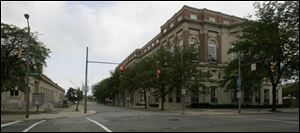The imposing Toledo Club building looms over the intersection of Madison Avenue and 14th Street in the western reaches of downtown Toledo.