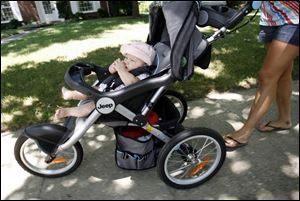 Veronica Lizcano, 5 months old, is content listening to
music in her stroller, which has a hookup for an iPod. She is the daughter of Mara and Randy Lizcano.