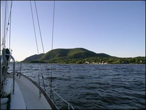The Catskill Mountains erupt from water s edge along New York s Hudson River.