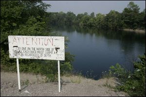A sign reminds visitors that they must file a dive plan when they submit their profile, including information about equipment. A 14-acre stone quarry, the Gilboa site boasts depths of more than 130 feet in some places. 