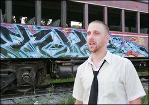 Artist Jerry Gray is circulating a petition to create designated public areas for graffiti artists in downtown Toledo. 