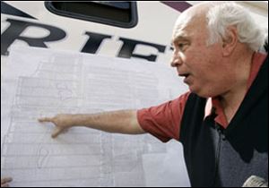 Robert E. Murray, founder and chairman of Cleveland-based Murray Energy Corp, points on a map to where six trapped coal miners are believed to be in his Crandall Canyon Mine.
