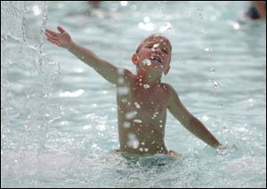 Ryan Wood, 6, frolics in the Municipal Pool in Perrysburg as the heat wave continues. Little relief is expected anytime soon, as forecasters are calling for highs of about 90 at least through Saturday, with rain today and tomorrow. Yesterday's storms produced more than an inch of rain. 