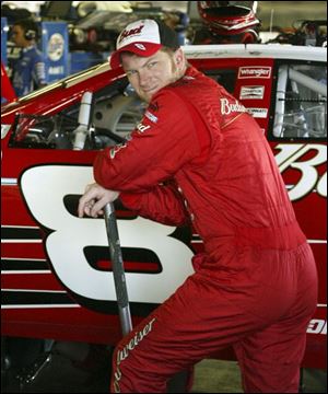 Dale Earnhardt Jr. checks out his car in the garage at MIS. Despite
being two spots out of the Chase, he s not too worried.