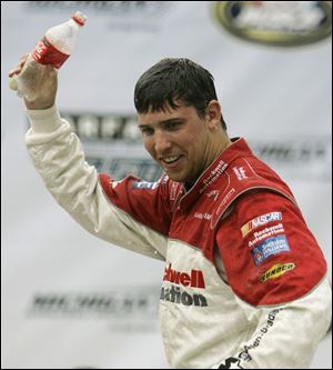 Denny Hamlin celebrates after winning the Carfax 250. His
winning margin of almost 7 seconds was the widest this year.