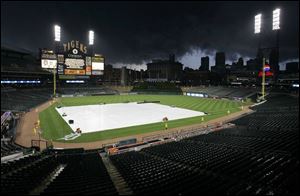 Storm clouds surround Comerica Park. The Tigers and Yankees waited four hours before starting at 11 last night.
