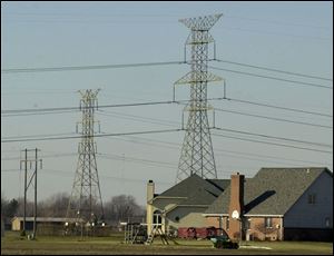 Power lines run near Oak Tree Court. Without any legislative action, consumers in Ohio would be sent into an electricity market in which competition hasn t developed.