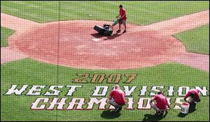 The grounds crew prepares Fifth Third Field for the Mud
Hens  bid for a third straight Governors  Cup. The Hens
clinched a spot in the International League playoffs with a
win Sunday at Indianapolis and will play either Richmond
or Durham in the fi rst round. As West Division champs, the Hens will host games three through five beginning Sept. 7.