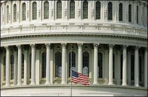 A flag at the U.S. Capitol flies at half-staff in honor of Rep. Paul Gillmor and former Rep. Jennifer Dunn. Both died Wednesday.
