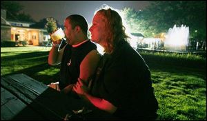 Markus and Karie Rodriguez relax and listen to the music provided by Dave Carpenter and the Jagglers.