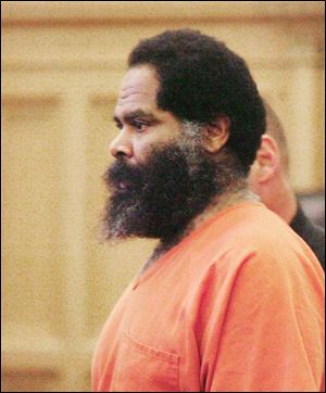 Calvin Neyland, Jr., is charged with the shooting deaths of two men at a trucking company.