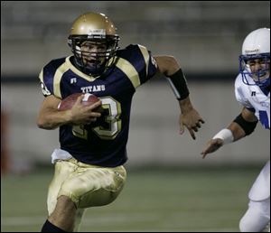 St. John s senior quarterback Rick Rattay runs for yardage. Rattay was an All-Ohio first team defensive back last season when he made 10 interceptions. He also returns punts.