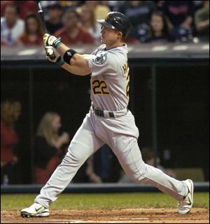 Oakland's Jack Hannahan clubs a two-run double off Indians pitcher Paul Byrd in the second inning of last night's game.