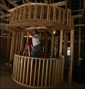 biz build23p  9/19 2007   The Blade/Herral Long  Jack Yoder of Mc Clure oh  electriction with  transtar elect    stand alone business   business/ real estate  section  various shots of workers  and building  Todd Schroyer builder  419 882 3315   lease info  419 882 7002   future home of Dr Matthew Malley DDS  and   Robert Malley DDS   419 882 0622