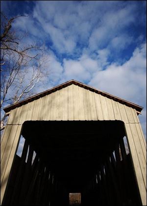 Black Covered Bridge runs 206 feet over Four Mile Creek. This 1868 design on Corso Road outside Oxford, Ohio, in Butler County is closed to motor
traffic.