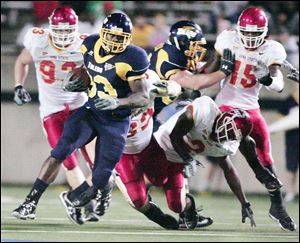 Jalen Parmele draws a crowd of Iowa State defenders as he ripped off this long run at the Glass Bowl Saturday night.