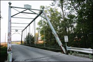 The Hancock Park District plans to have the bridge dismantled and stored, then repaired and reassembled.