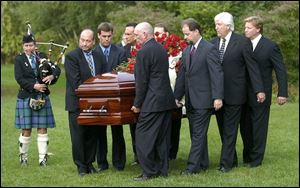 The casket of Rex Humbard is carried into a hall in Akron for his 'Home Going Celebration.'