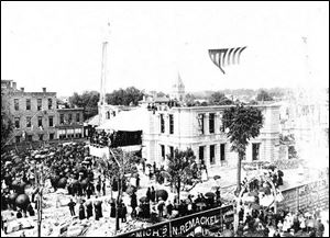 Crowds thronged the streets of downtown Tiffin for the laying of the cornerstone of the Seneca County Courthouse in June, 1884.