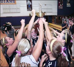 Notre Dame players celebrate their victory over Central Catholic in the City League volleyball championship at Waite.

