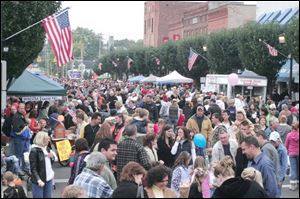 A throng gathered near the downtown to eat, be entertained, and be neighborly.