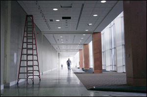 Craig Meeker of Laibe Electric Co. in Toledo, walks through the building, which is scheduled to open in January.