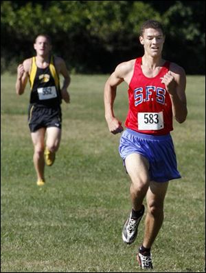 Colin Pettiford of St. Francis pulls away from Northview's Nick Esbin on the way to a victory in 16:02.3 at Pearson Park.