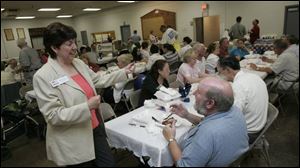 Democratic candidate Robin Weirauch talks to supporters at the chicken dinner in Defiance, which was a fund-raising event for her campaign against her primary opponent, George Mays.