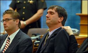 Scott Speer, right, and his attorney, J. Anthony Rich, react to the verdict in Port Cliton yesterday. 