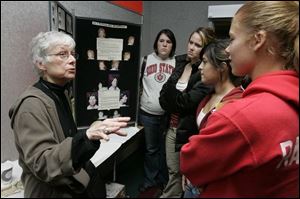Julie Mather Saul, left, talks to Wauseon High School juniors Molly Merillat, Sabrina Kessler, Lexi Pflager, and Amanda Lee Rabender.