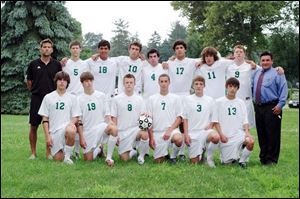 The Ottawa Hills boys' soccer team is, front row, from left, David Joseph, Jack Jamieson, Ben Bryant, Sam Kuehnle, Reid Glosser, and Emerson Saum, and, back row, from left, coach Greg McElroy, Sam Rumpf, Jake Bruner, Eliot Browarsky, David Sherry, Josh Bruner, Kevin Elliott, and Kevin Nugent. Not pictured: Jordan Bernardo, Charles Deluga, David McChesney, and Ian Monroe.