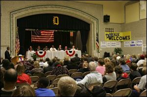 The seven candidates for the Toledo Board of Education field questions during the debate at DeVeaux Middle School.
