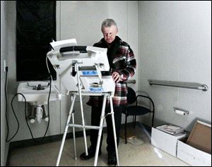 Steven Hile casts an absentee ballot in the temporary Hancock County Board of Elections headquarters in Findlay.
