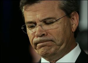 Republican Gov. Ernie Fletcher pauses as he delivers his concession speech after losing the Kentucky gubernatorial race to Democrat Steve Beshear.