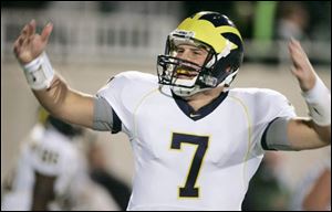 Chad Henne celebrates throwing the winning touchdown pass
to Mario Manningham against Michigan State on Saturday.
<br>
<img src=http://www.toledoblade.com/graphics/icons/audio.gif> <font color=red><b>AUDIO:</b></font> <a href=