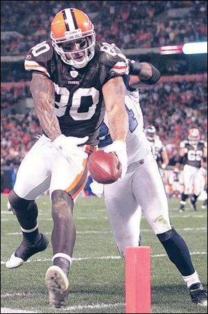 Cleveland tight end Kellen Winslow is knocked out of bounds short of the goal line by Seattle defender Deon Grant. The hard-nosed Browns tight end had 11 receptions for 125 yards.