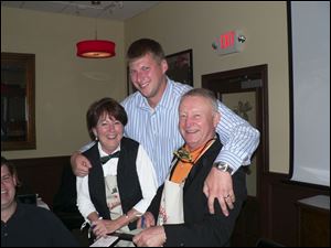 Jill Ducey, left, and Mike Ducey entertain guest Jake Holmes, center, during the celebrity wait night for the YWCA at the Rouge.