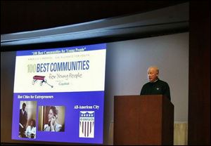 Mayor Carty Finkbeiner practices presenting the city as one of the world's most liveable.