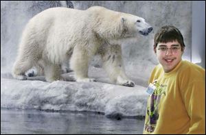 Scott McGorty of Bowsher High School is on the job as a volunteer at the Toledo Zoo.