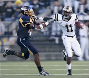 Toledo safety Barry Church, left, shown making a tackle against Western Michigan, is looking for some help on defense next year and is 
especially anxious to team up with 
experienced 
players. The 
Rockets were near the bottom of the 
Mid-American 
Conference in 
several defensive statistical 
categories while compiling a 5-7 record.