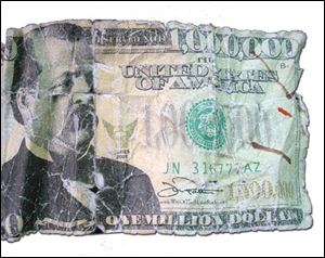 This photo, supplied by the Aiken County,S.C., County Sheriff's Office, shows a fake $1 million bill, which a man tried to use to open an account in a Aiken, S.C, bank Monday.