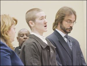 Robert Jobe, flanked by his attorneys, David Klucas and Ann Baronas, apologizes to the Dressel family and the court during his sentencing for killing police Detective Keith Dressel. 