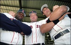Roger Clemens, center, mugs for the camera with Red Sox 
ex-teammates Mo Vaughn, left, and Jose Canseco in 1995.