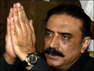 Asif Ali Zardari, husband of slain Pakistan's opposition leader Benazir Bhutto, thanks supporters for their condolences at his house in Naudero near Larkana, Pakistan on Tuesday. (ASSOCIATED PRESS)
<br>
<br>
<img src=http://www.toledoblade.com/graphics/icons/video.gif><b><font color=red>AP VIDEO</b></font color=red>: <a href=