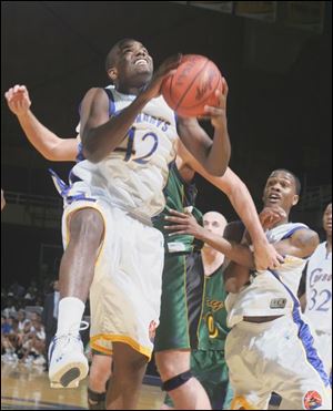 Libbey's Rodney Everage glides to the basket against Clay last night at Savage Hall. The Cowboy's improved to 11-1.