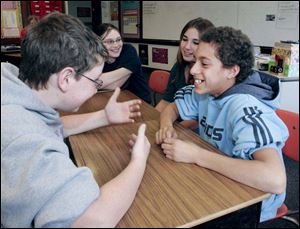From left, Jay Gentry, Jesse Hillabrand, Ahna Ochoa, and Devin Snowden, fifth graders at Luckey Elementary, discuss their picks. 
